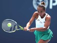 Leylah Fernandez of Canada returns a shot against Jessica Pegula during their match on Day 9 of the Miami Open at Hard Rock Stadium on March 24, 2024 in Miami Gardens, Fla.