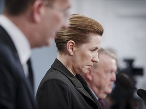 Danish Prime Minister Mette Frederiksen, centrE, speaks during a press conference on strengthening the country's armed forces, at the State Ministry, Christiansborg, in Copenhagen, Wednesday, March 13, 2024.
