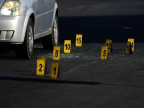 Evidence markers indicate the location of bullet casings