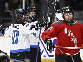 Toronto's Natalie Spooner (24) celebrates her goal with Blayre Turnbull (40) as Ottawa's Natalie Snodgrass (8) skates away, during first period PWHL action in Ottawa, Saturday, March 2, 2024.