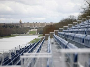 The stands to watch the equestrian sports are seen Friday, March 29, 2024 in the park of the Chateau de Versailles, seen in background, west of Paris. The site will be the venue for equestrian sports at the Paris 2024 Olympic Games.