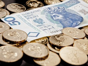 Polish zloty currency notes and coins are seen in this arranged photograph in Wroclaw, Poland, on Monday, Oct. 3, 2011.