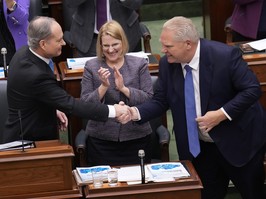 Premier Ford with cabinet minister after unveiling budget