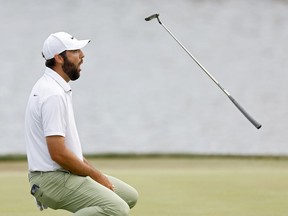 Scottie Scheffler reacts after a putt on the 18th green