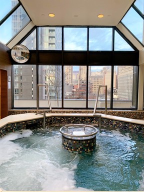 A hot tub in Le Centre Sheraton Montreal overlooks the downtown core.