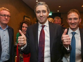 Simon Harris (centre) is welcomed to the Fine Gael convention at the Sheraton Hotel in Athlone, central Ireland on March 24, 2024, before being declared leader and de facto prime minister-in-waiting.