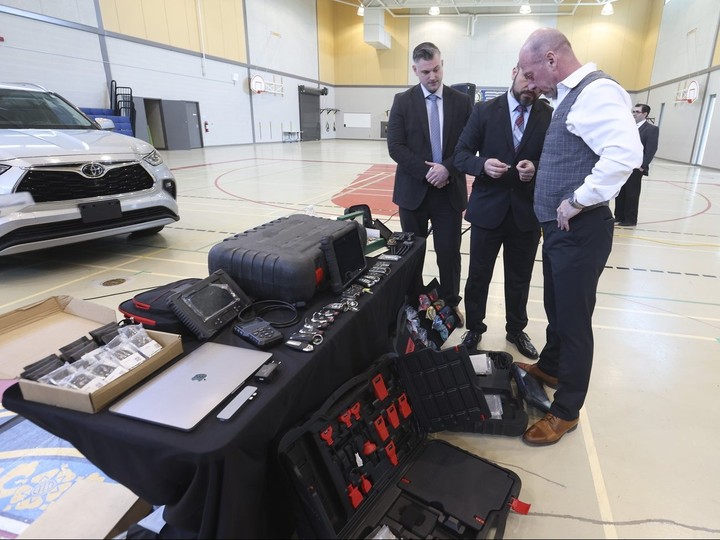  Supt. Steve Watts, of the Toronto Police organized crime unit, looks over key fobs and registration and diagnostic tools seized during Project Paranoid on Wednesday, March 27, 2024, at the Toronto Police College in Etobicoke.