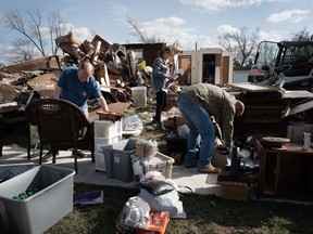 Residents clean up after a tornado ripped through town