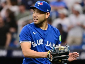 Blue Jays starting pitcher Yusei Kikuchi reacts following the first inning against the Rays at Tropicana Field in St Petersburg, Fla., Saturday, March 30, 2024.