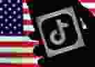 In this file photo illustration, the social media application logo, TikTok is displayed on the screen of an iPhone on an American flag background on August 3, 2020 in Arlington, Virginia. -  
