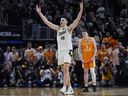 Purdue centre Zach Edey (15) reacts near Tennessee guard Dalton Knecht (3) after the team defeated Tennessee in an Elite Eight college basketball game in the NCAA Tournament, Sunday, March 31, 2024, in Detroit.