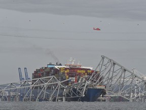 A partially collapsed Francis Scott Key Bridge after a container ship struck a support column on Tuesday in Baltimore.