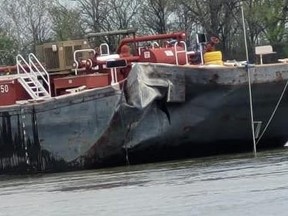 A barge is damaged after hitting a bridge along the Arkansas River in Oklahoma.