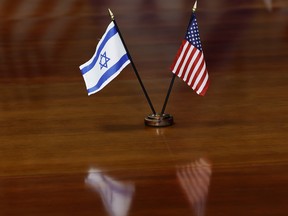 The flags of Israel and the United States are seen