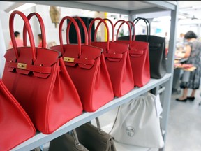 A photo taken on June 11, 2015 shows Hermes Birkin bags at the Maroquinerie de la Tardoire, a Hermes workshop specialized in products made with calfskin, in Montbron, southwestern France.