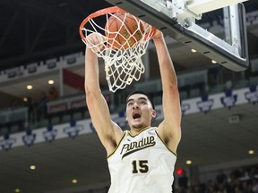 Purdue centre Zach Edey (15) dunks during second half NCAA basketball action of the 2023 Hall of Fame Series against Alabama, in Toronto, Saturday, Dec. 9, 2023.