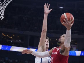 Canada forward Dillon Brooks (24) shoots against U.S. centre Walker Kessler (14) during the Basketball World Cup bronze medal game between the United States and Canada in Manila, Philippines, Sunday, Sept. 10, 2023.