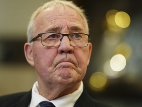 National Defence Minister Bill Blair speaks to reporters on Parliament Hill in Ottawa on Dec. 6, 2023. (The Canadian Press)