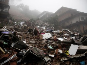 Debris from homes destroyed by a landslide caused by heavy rains in Petropolis, Rio de Janeiro state, Brazil, Saturday, March 23, 2024.