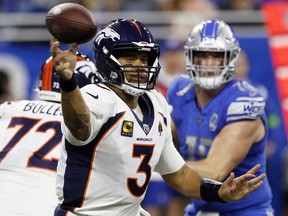 Denver Broncos quarterback Russell Wilson throws during the first half of an NFL football game against the Detroit Lions, Dec. 16, 2023, in Detroit.