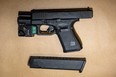 This handgun was allegedly seized when two teens were arrested in Toronto for an armed home invasion and a carjacking that occurred in Brampton on Thursday, March 14, 2024.