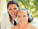Brandy Cooney, left, and Becky Hamber on their 2014 wedding day. The pair have been charged with first-degree murder in the death their foster child, a 12-year-old boy. FACEBOOK