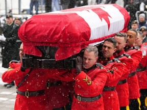 RCMP pallbearers carry the casket to the funeral of the former prime minister Brian Mulroney in Montreal Saturday, March 23, 2024.