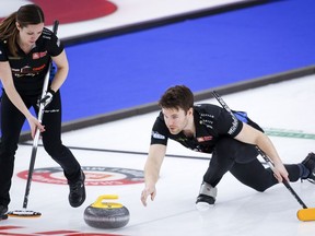 Laura Walker and Kirk Muyres earned a 9-3 win over Jasmin Gibeau and Audrey Laplante to improve to 3-0 at the Canadian mixed doubles curling championship on Monday.&ampnbsp;Muyres, right, makes a shot as Walker sweeps while they play Team Einarson/Gushue at the Canadian Mixed Doubles Curling Championship in Calgary, Alta., Wednesday, March 24, 2021.