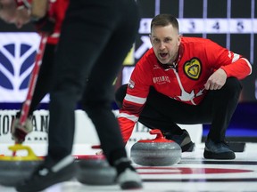 Canada skip Brad Gushue calls out to the sweepers while playing Nova Scotia during the Brier, in Regina, on Friday, March 1, 2024.