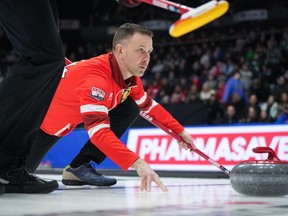 Defending champion Brad Gushue delivers a rock while playing Team Manitoba-Carruthers during the playoffs at the Brier in Regina, Friday, March 8, 2024.