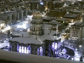 The Colorado State Capitol is covered in snow early Thursday, March 14, 2024 in Denver.