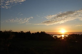 The sun rises over Florida Bay in Flamingo at Everglades National Park. The balcony at Flamingo Lodge is a perfect place to enjoy a cup of coffee and a beautiful view. Sunrise and sunset times are posted daily on a white board in the main office.