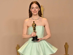 Emma Stone poses in the press room with the Oscar for Best Actress in a Leading Role for "Poor Things" during the 96th Annual Academy Awards at the Dolby Theatre in Hollywood, Calif., on March 10, 2024.