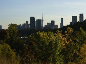 The Toronto skyline is photographed behind a canopy of trees on Wednesday, Oct. 5, 2022.