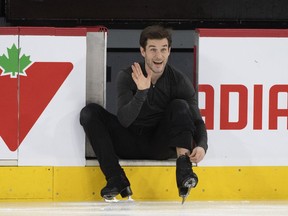Ice dancer Nikolaj Sorensen of Canada waves as he adjusts his skates at practice ahead of the 2024 ISU World Figure Skating Championships in Montreal, Wednesday, March 6, 2024. Canada's figure skating team is taking the ice at the Bell Centre ahead of the world championships set for March 18-24.