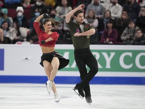 Laurence Fournier Beaudry and Nikolaj Sorensen of Canada perform their rhythm dance in the ice dance competition during the 2024 ISU World Figure Skating Championships in Montreal, Friday, March 22, 2024.