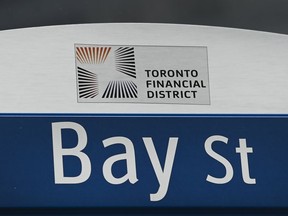 A street sign along Bay Street in Toronto's financial district in Toronto on Tuesday, January 12, 2021.&ampnbsp;People should check the credentials of the person they are seeking financial advice from, Ontario's financial services regulator's latest education campaign says.