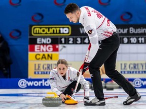 Canada's Jocelyn Peterman and Brett Gallant, right, in action during the Round Robin game between England and Canada at the World Mixed Doubles Curling Championship 2022, at the Sous-Moulin Sports Centre, in Geneva, Switzerland, Wednesday, April 27, 2022.