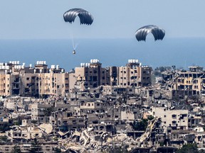 parachutes of humanitarian aid dropping