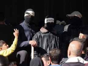 Masked members of the so-called Popular Committees of Protection