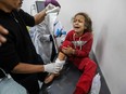 Palestinians injured in Israeli airstrikes arrive at Kuwait Hospital for treatment on March 19, 2024 in Rafah, Gaza.