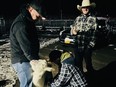 Volunteers milk one of Jose Garcia's goats in the parking lot of Tractor Supply Co. in Stansbury Park, Utah, on March 2, 2024.