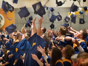 From 2010: Students from St Joseph's High School in Barrhaven celebrate their graduation by throwing their mortar board hats into the air during ceremonies at Lansdowne Park.