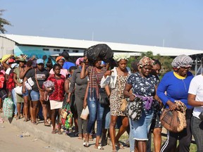 Haitians cross the border between Quanamienthe in Haiti and Dajabon in the Dominican Republic to work in the binational market in Dajabon, Dominican Republic on March 8, 2024.