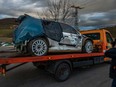 A car involved in an accident is taken away from the road near the crash site during the Esztergom Nyerges Rally on March 24, 2024, near Bajot, 55 km away from Budapest.