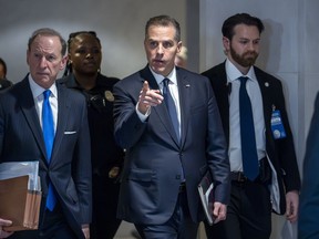 Hunter Biden, son of U.S. President Joe Biden, with attorney Abbe Lowell, left, leaves after a closed-door deposition in the Republican-led investigation into the Biden family, on Capitol Hill in Washington, Feb. 28, 2024.
