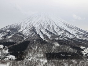 This aerial photo shows Mt. Yotei where an avalanche hit a group of backcountry skiers, in Kutchan, Hokkaido, on March 11, 2024. (Kyodo News via AP)
