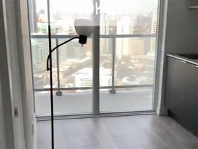 Screenshot of living room and kitchen in tiny condo in Toronto.