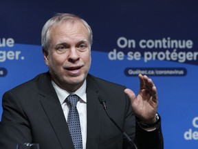 Dr. Luc Boileau responds to a question during a news conference in Montreal, Tuesday, Jan. 11, 2022.