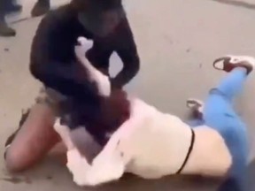 Screenshot of two teen girls in fight near Missouri high school.